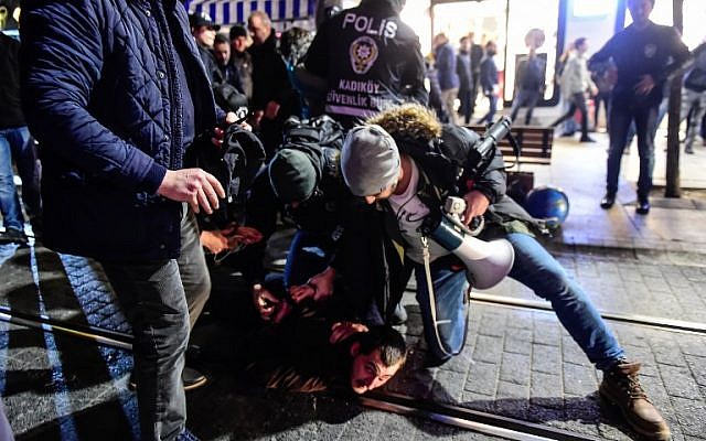 Turkish anti-riot police officers detain a leftist protester during a demonstration against the US and Israel on December 9, 2017 in the Kadikoy district of Istanbul. (AFP PHOTO/YASIN AKGUL) Turkish anti-riot police officers detain a leftist protester during a demonstration against the US and Israel on December 9, 2017 in the Kadikoy district of Istanbul. (AFP PHOTO/YASIN AKGUL)