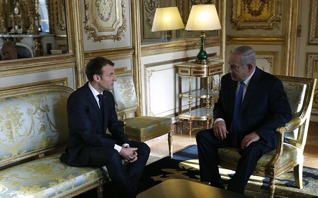 French President Emmanuel Macron (L) speaks with Israel Prime Minister Benjamin Netanyahu ahead of a meeting at The Elysee Palace in Paris on December 10, 2017. (AFP PHOTO / POOL / PHILIPPE WOJAZER) French President Emmanuel Macron (L) speaks with Israel Prime Minister Benjamin Netanyahu ahead of a meeting at The Elysee Palace in Paris on December 10, 2017. (AFP PHOTO / POOL / PHILIPPE WOJAZER)