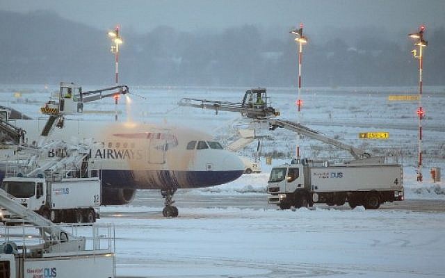 A British Airways airplane being de-iced on the tarmac of the airport in Duesseldorf, Germany, on December 10, 2017. (AFP Photo/dpa/David Young/ Germany OUT) A British Airways airplane being de-iced on the tarmac of the airport in Duesseldorf, Germany, on December 10, 2017. (AFP Photo/dpa/David Young/ Germany OUT)