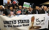 Arab Israelis take part in a protest outside the American embassy in Tel Aviv against US President Donald Trump's decision to recognize Jerusalem as Israel's capital on December 12, 2017. (AFP Photo/Jack Guez)