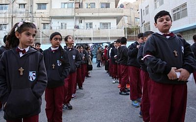 Iraqi Christian students line up at the Latin Patriarchate school in the Marka district in the eastern part of Jordan's capital Amman on December 12, 2017. (AFP Photo/Khalil Mazraawi)