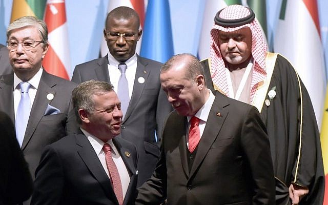 Turkish President Recep Tayyip Erdogan (front row, R) speaks with Jordan's King Abdullah as they pose for a group photo during an Extraordinary Summit of the Organization of Islamic Cooperation (OIC) on last week's US recognition of Jerusalem as Israel's capital, on December 13, 2017 in Istanbul. (AFP PHOTO / YASIN AKGUL) Turkish President Recep Tayyip Erdogan (front row, R) speaks with Jordan's King Abdullah as they pose for a group photo during an Extraordinary Summit of the Organization of Islamic Cooperation (OIC) on last week's US recognition of Jerusalem as Israel's capital, on December 13, 2017 in Istanbul. (AFP PHOTO / YASIN AKGUL)