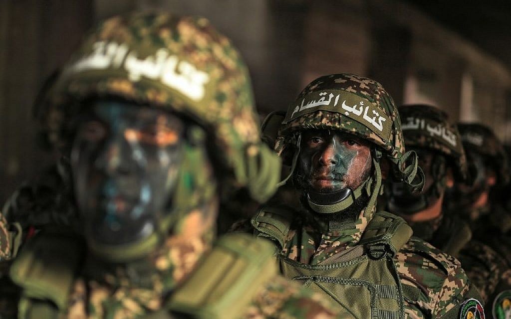 Hamas fighters take part in a rally marking the 30th anniversary of the founding of the terror group in Gaza City on December 14, 2017. (AFP Photo/Mohammed Abed) Hamas fighters take part in a rally marking the 30th anniversary of the founding of the terror group in Gaza City on December 14, 2017. (AFP Photo/Mohammed Abed)
