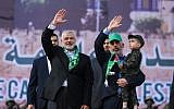 Hamas leader Ismail Haniyeh (L) and Hamas's leader in the Gaza Strip Yahya Sinwar wave during a rally marking the 30th anniversary of the founding of the Islamist terror movement, in Gaza City, on December 14, 2017. (Mohammed Abed/AFP)