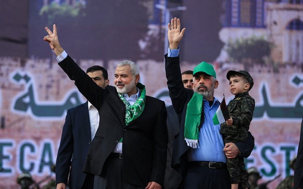 Hamas chief Ismail Haniyeh (L) and Hamas leader in the Gaza Strip Yahya Sinwar attend a rally marking the 30th anniversary of the terror group's founding in Gaza City, on December 14, 2017. (AFP Photo/Mohammed Abed)