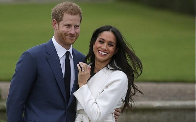 This file photo taken on November 27, 2017, shows Britain's Prince Harry standing with his fiancée US actress Meghan Markle as she shows off her engagement ring whilst they pose for a photograph in the Sunken Garden at Kensington Palace in London. (AFP Photo/Daniel Leal-Olivas) This file photo taken on November 27, 2017, shows Britain's Prince Harry standing with his fiancée US actress Meghan Markle as she shows off her engagement ring whilst they pose for a photograph in the Sunken Garden at Kensington Palace in London. (AFP Photo/Daniel Leal-Olivas)