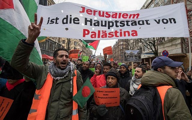 Protesters hold a banner reading 'Jerusalem is the capital of Palestine' during a demonstration of members of the Palestinian community on December 16, 2017 in Frankfurt am Main, to protest against the US decision to recognize Jerusalem as Israel's capital. (AFP/dpa/Boris Roessler) Protesters hold a banner reading 'Jerusalem is the capital of Palestine' during a demonstration of members of the Palestinian community on December 16, 2017 in Frankfurt am Main, to protest against the US decision to recognize Jerusalem as Israel's capital. (AFP/dpa/Boris Roessler)