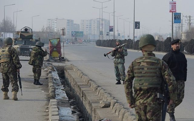 Illustrative: Afghan National Army (ANA) soldiers keep watch at the side of an ongoing attack in Kabul on December 18, 2017. (Shah Marai/AFP) Illustrative: Afghan National Army (ANA) soldiers keep watch at the side of an ongoing attack in Kabul on December 18, 2017. (Shah Marai/AFP)
