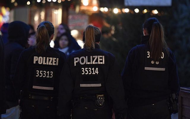 Illustrative: Policewomen patrol at the Christmas market at Breitscheidplatz near the Kaiser-Wilhelm-Gedaechtniskirche (Kaiser Wilhelm Memorial Church) in Berlin one day ahead of the anniversary of last year's deadly truck attack in Berlin, on December 18, 2017. (AFP Photo/John MACDOUGALL) Illustrative: Policewomen patrol at the Christmas market at Breitscheidplatz near the Kaiser-Wilhelm-Gedaechtniskirche (Kaiser Wilhelm Memorial Church) in Berlin one day ahead of the anniversary of last year's deadly truck attack in Berlin, on December 18, 2017. (AFP Photo/John MACDOUGALL)