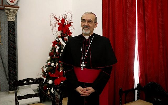 Archbishop Pierbattista Pizzaballa, Apostolic Administrator of the Latin Patriarchate of Jerusalem, stands at the end of the annual pre-Christmas press conference at the Latin Patriarchate headquarters in the old city of Jerusalem on December 20, 2017. (AFP PHOTO / GALI TIBBON) Archbishop Pierbattista Pizzaballa, Apostolic Administrator of the Latin Patriarchate of Jerusalem, stands at the end of the annual pre-Christmas press conference at the Latin Patriarchate headquarters in the old city of Jerusalem on December 20, 2017. (AFP PHOTO / GALI TIBBON)