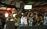 African National Congress delegates cheer the closing speech of newly elected African National Congress (ANC) President, Cyril Rampahosa, on the final day of the 54th ANC conference at the NASREC Expo Centre in Johannesburg, December 20, 2017. (AFP/Wikus De Wet)