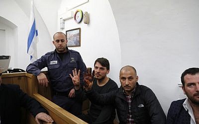 Turkish tourists, who were arrested earlier in the week at a holy site in Jerusalem following Muslim prayers, are seen at an Israeli court in Jerusalem, on December 23, 2017. (AFP PHOTO / Ahmad GHARABLI)