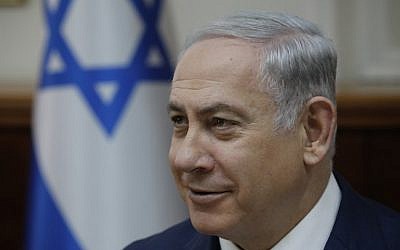 Prime Minister Benjamin Netanyahu is seen at the weekly cabinet meeting at the Prime Minister's Office in Jerusalem on December 24, 2017. (AFP Photo/AFP Photo and Pool/Amir Cohen)