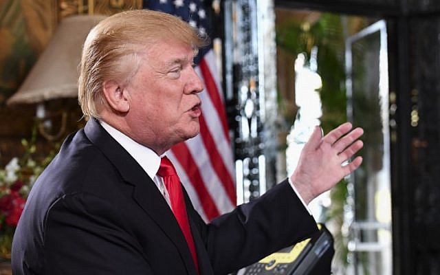 US President Donald Trump in a video teleconference call with military personnel on Christmas Eve in Palm Beach, Florida, on December 24, 2017. (AFP Photo/Nicholas Kamm) US President Donald Trump in a video teleconference call with military personnel on Christmas Eve in Palm Beach, Florida, on December 24, 2017. (AFP Photo/Nicholas Kamm)