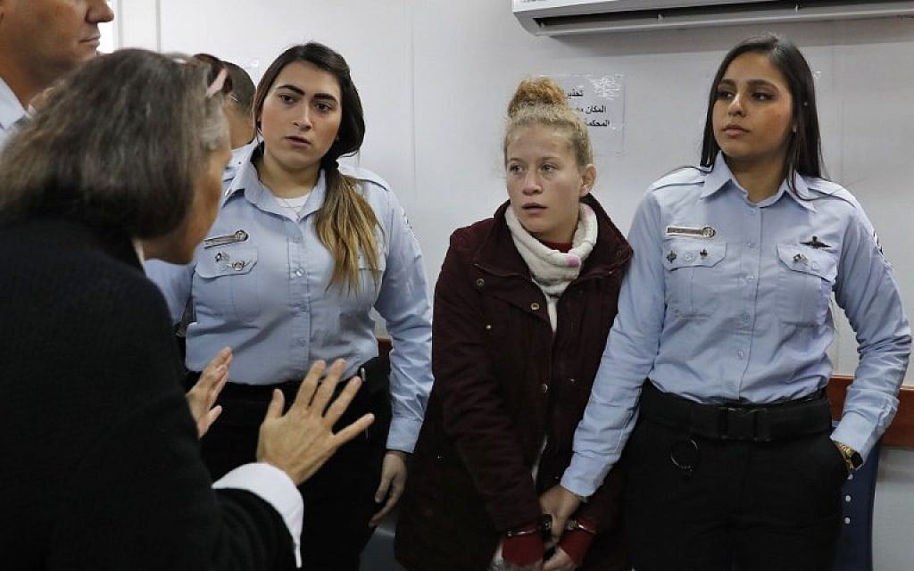 Ahed Tamimi (2nd-R) appears at the military court at the West Bank's Ofer prison on December 25, 2017. (AFP Photo/Ahmad Gharabli)