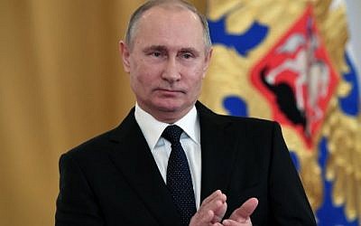 Russian President Vladimir Putin attends a ceremony to bestow state awards on military personnel who fought in Syria, at the Kremlin in Moscow on December 28, 2017. (Kirill Kudrayvstev/AFP)