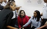 Nour Tamimi (C) who is being detained after a viral video showing her with two members of her family allegedly assaulting two Israeli soldiers is seen in a military court at the Ofer prison in the West Bank on December 28, 2017. (Ahmad Gharabli/AFP)