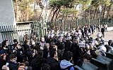 Iranian students scuffle with police at the University of Tehran during a demonstration on December 30, 2017. (AFP/STR)