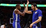 Kevin Durant #35 of the Golden State Warriors celebrates a second half basket with Omri Casspi #18 while playing the Detroit Pistons at Little Caesars Arena on December 8, 2017 in Detroit, Michigan. (Gregory Shamus/Getty Images/AFP)