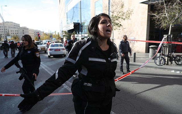 Illustrative: Police officers close off the area around Jerusalem Central Bus Station, after a Palestinian terrorist stabbed a security guard there, on December 10, 2017. (Yonatan Sindel/Flash90) Illustrative: Police officers close off the area around Jerusalem Central Bus Station, after a Palestinian terrorist stabbed a security guard there, on December 10, 2017. (Yonatan Sindel/Flash90)