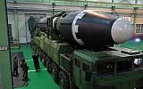 This November 29, 2017, image provided by the North Korean government on Thursday, November 30, 2017, shows North Korean leader Kim Jong Un, third from left, and what the North Korean government calls the Hwasong-15 intercontinental ballistic missile, in North Korea. (Korean Central News Agency/Korea News Service via AP)