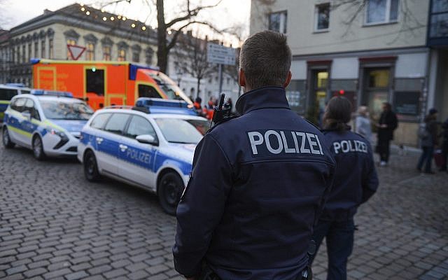 Illustrative: Police close the streets around a Christmas market after a suspicious object was found in Potsdam, Germany, on Dec. 1, 2017. (Julian Staehle/dpa via AP) Illustrative: Police close the streets around a Christmas market after a suspicious object was found in Potsdam, Germany, on Dec. 1, 2017. (Julian Staehle/dpa via AP)