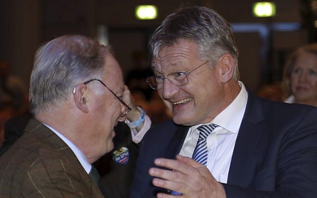 The new elected party chairmen Joerg Meuthen, right, and Alexander Gauland shake hands during a party convention of the Alternative for Germany, AfD, party in Hannover, Germany, Saturday, Dec. 2, 2017. (AP Photo/Michael Sohn) The new elected party chairmen Joerg Meuthen, right, and Alexander Gauland shake hands during a party convention of the Alternative for Germany, AfD, party in Hannover, Germany, Saturday, Dec. 2, 2017. (AP Photo/Michael Sohn)