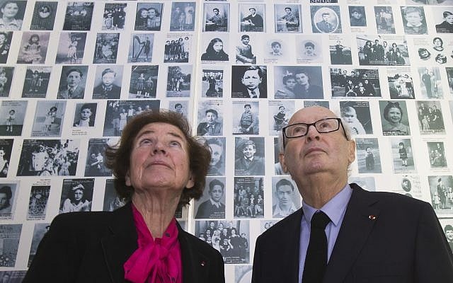In this December 5, 2017, photo, French Nazi hunters Beate Klarsfeld (l) and her husband Serge look at at photos of young Jews deported from France at the Shoah Memorial in Paris, France. (AP Photo/Michel Euler) In this December 5, 2017, photo, French Nazi hunters Beate Klarsfeld (l) and her husband Serge look at at photos of young Jews deported from France at the Shoah Memorial in Paris, France. (AP Photo/Michel Euler)