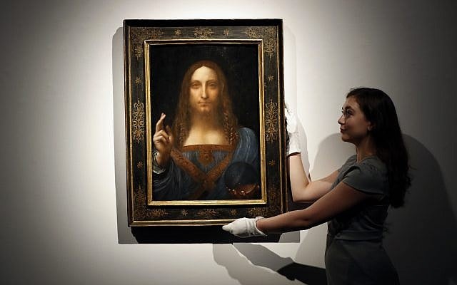 In this October 24, 2017, photo, an employee poses with Leonardo da Vinci's "Salvator Mundi" on display at Christie's auction rooms in London. (AP Photo/Kirsty Wigglesworth) In this October 24, 2017, photo, an employee poses with Leonardo da Vinci's "Salvator Mundi" on display at Christie's auction rooms in London. (AP Photo/Kirsty Wigglesworth)