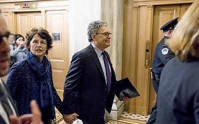 Sen. Al Franken, D-Minn., arrives with his wife Franni Bryson, left, at Capitol Hill in Washington, December 7, 2017.  (AP Photo/Andrew Harnik)