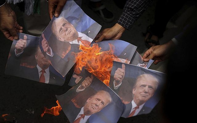 Muslim men burn portraits of US President Donald Trump and rally against his decision to recognize Jerusalem as Israel's capital in Banda Aceh, Indonesia, Friday, Dec. 8, 2017. (AP Photo/Heri Juanda) Muslim men burn portraits of US President Donald Trump and rally against his decision to recognize Jerusalem as Israel's capital in Banda Aceh, Indonesia, Friday, Dec. 8, 2017. (AP Photo/Heri Juanda)