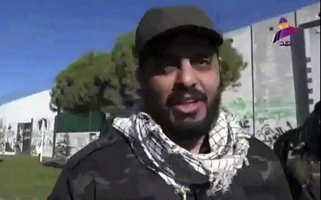 This frame grab from video provided on Dec. 8, 2017, by Asaid Ahl al-Haq's TV station al-Ahd, shows Iraqi militia commander Qais al-Khazali of the Iranian-backed Asaib Ahl al-Haq, or League of the Righteous, speaking in front of a wall that was built by Israel at the Fatima Gate border point in the southern village of Kfar Kila, Lebanon. (Al-Ahd TV station via AP) This frame grab from video provided on Dec. 8, 2017, by Asaid Ahl al-Haq's TV station al-Ahd, shows Iraqi militia commander Qais al-Khazali of the Iranian-backed Asaib Ahl al-Haq, or League of the Righteous, speaking in front of a wall that was built by Israel at the Fatima Gate border point in the southern village of Kfar Kila, Lebanon. (Al-Ahd TV station via AP)