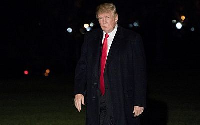 US President Donald Trump walks across the South Lawn of the White House on Dec. 10, 2017. (AP Photo/Andrew Harnik)
