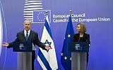 European Union High Representative Federica Mogherini, right, and Prime Minister Benjamin Netanyahu address a media conference at the EU Council building in Brussels on Monday, December 11, 2017. (AP Photo/Virginia Mayo)