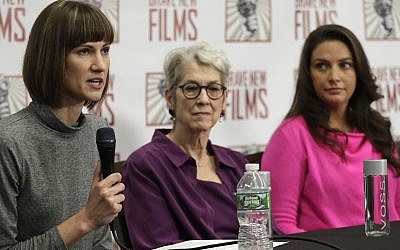Rachel Crooks, left, Jessica Leeds, center, and Samantha Holvey attend a news conference, December 11, 2017, in New York to discuss their accusations of sexual misconduct against US President Donald Trump. (AP Photo/Mark Lennihan)