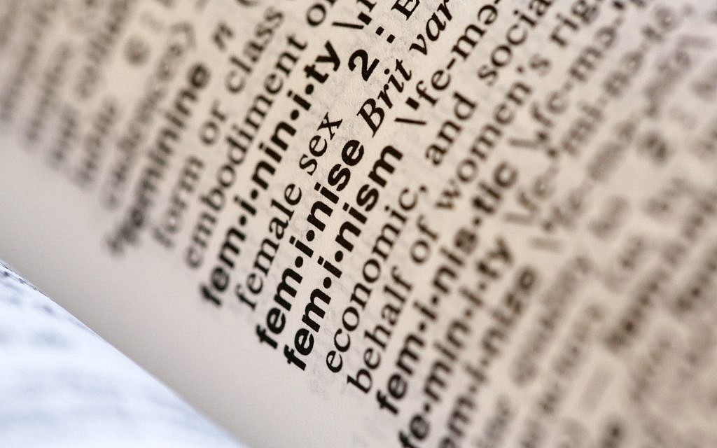 This photo taken in New York on Dec. 11, 2017, shows the word feminism listed in the dictionary. (AP Photo/Peter Morgan)