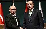 Turkey's President Recep Tayyip Erdogan, right, shakes hands with Russia's President Vladimir Putin, left, following their joint news statement after their meeting at the Presidential Palace in Ankara, on Dec. 11, 2017. (AP Photo/Burhan Ozbilici)