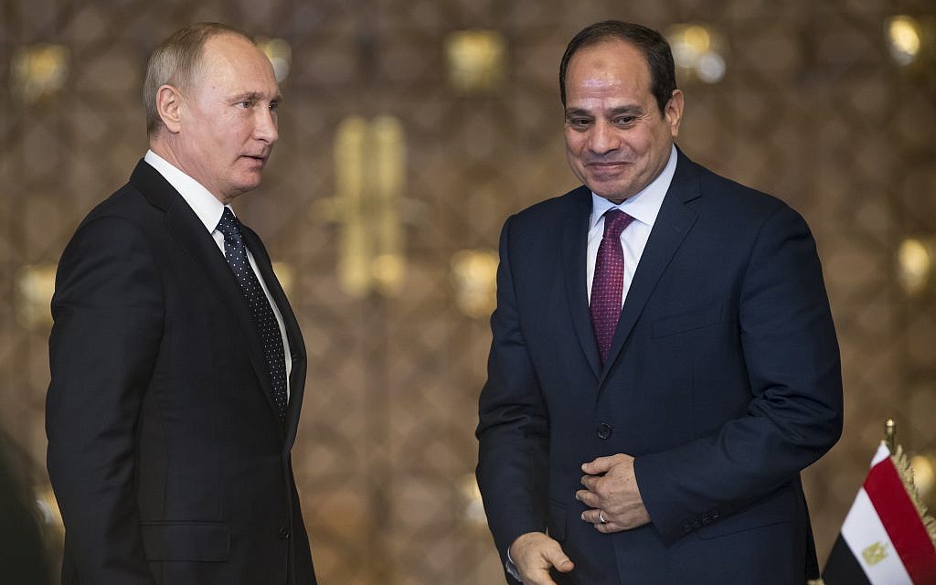 Russian President Vladimir Putin, right, and Egyptian President Abdel-Fattah El-Sissi, leave a news conference following their talks in Cairo, Egypt, December 11, 2017. (AP Photo/Alexander Zemlianichenko, pool)