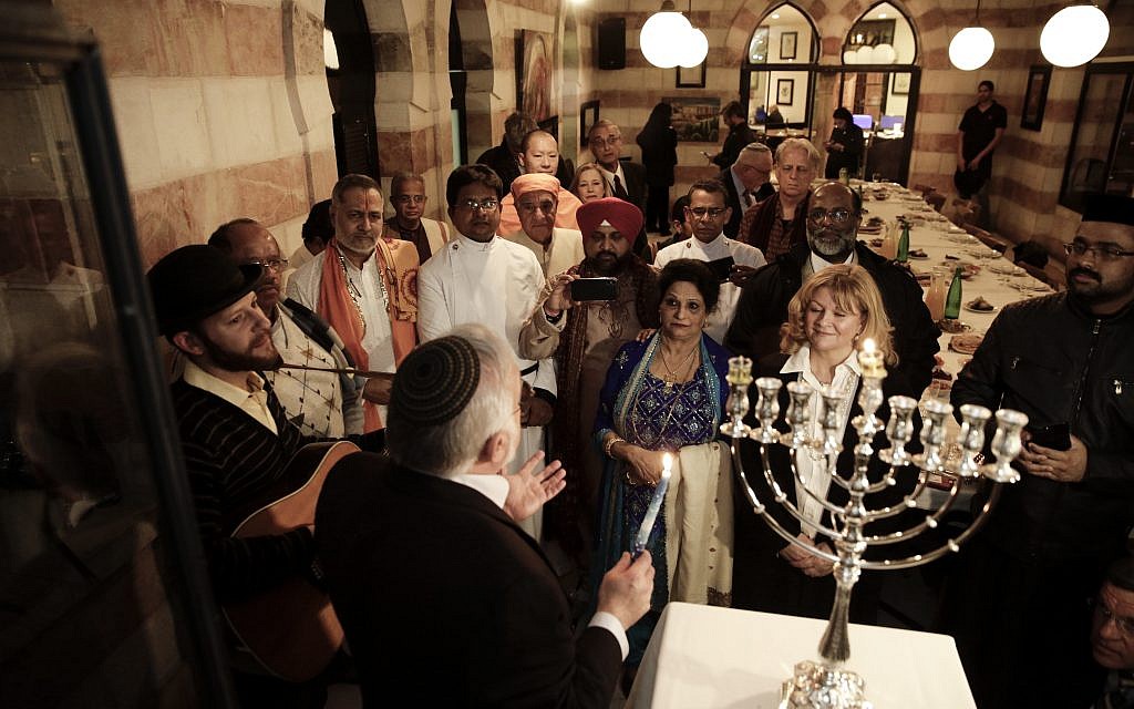 Illustrative: An interfaith group from the Gulf state of Bahrain attends Hanukkah candle lighting in Jerusalem, December 12, 2017. (AP Photo/Mahmoud Illean) Illustrative: An interfaith group from the Gulf state of Bahrain attends Hanukkah candle lighting in Jerusalem, December 12, 2017. (AP Photo/Mahmoud Illean)