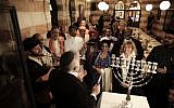 Illustrative: An interfaith group from the Gulf state of Bahrain attends Hanukkah candle lighting in Jerusalem, December 12, 2017. (AP Photo/Mahmoud Illean)