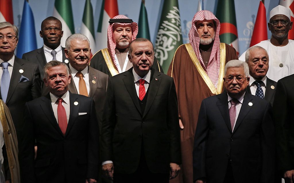 Turkish President Recep Tayyip Erdogan, center, flanked by Jordan's King Abdullah II, left and Palestinian Authority President Mahmoud Abbas, right, poses for photographs with other leaders during a photo-op prior to the opening session of the Organisation of Islamic Cooperation in Istanbul, December 13, 2017. (Lefteris Pitarakis/AP) Turkish President Recep Tayyip Erdogan, center, flanked by Jordan's King Abdullah II, left and Palestinian Authority President Mahmoud Abbas, right, poses for photographs with other leaders during a photo-op prior to the opening session of the Organisation of Islamic Cooperation in Istanbul, December 13, 2017. (Lefteris Pitarakis/AP)