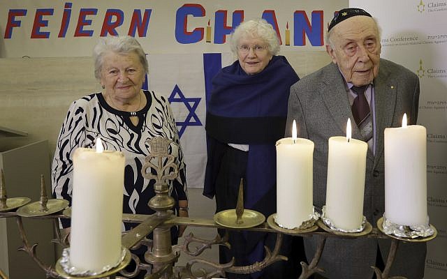 From left, Holocaust survivors Assia Gorban, Marlene Herzberg and Rudolf Rosenberg attend a reception and Hanukkah candle lighting at the Jewish Community Center, in Berlin, Germany, Thursday, Dec. 14, 2017. (AP Photo/Michael Sohn) From left, Holocaust survivors Assia Gorban, Marlene Herzberg and Rudolf Rosenberg attend a reception and Hanukkah candle lighting at the Jewish Community Center, in Berlin, Germany, Thursday, Dec. 14, 2017. (AP Photo/Michael Sohn)