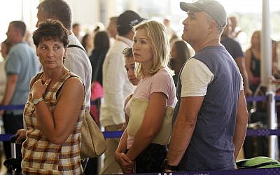 In this file photo taken on Nov. 9, 2015, Russian passengers prepare to depart from Sharm el-Sheikh Airport in south Sinai, Egypt. (AP Photo/Ahmed Abd El-Latif)