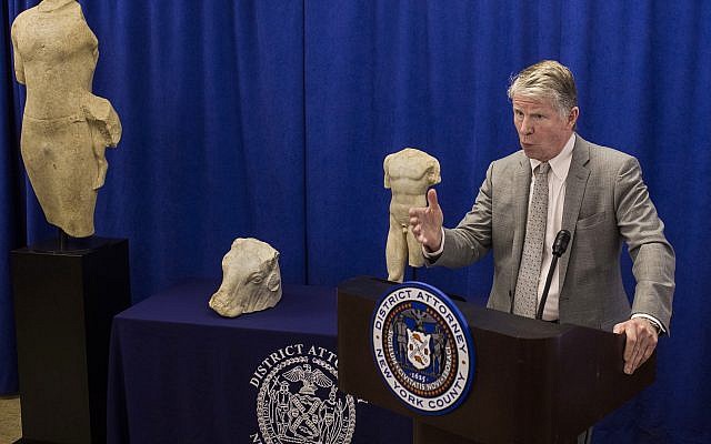 Manhattan District Attorney Cyrus R. Vance discusses the repatriation of three ancient sculptures during a news conference in New York. The sculptures, from left, the "Calf Bearer,' the 'Bull's Head,' and the 'Torso,' are being returned to their rightful owners in Lebanon as Vance forms a new antiquities trafficking unit, on December 15, 2017. (AP Photo/Andres Kudacki) Manhattan District Attorney Cyrus R. Vance discusses the repatriation of three ancient sculptures during a news conference in New York. The sculptures, from left, the "Calf Bearer,' the 'Bull's Head,' and the 'Torso,' are being returned to their rightful owners in Lebanon as Vance forms a new antiquities trafficking unit, on December 15, 2017. (AP Photo/Andres Kudacki)