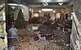 A Pakistani walks in the main hall of a church following a suicide attack in Quetta, Pakistan, December 17, 2017. (Arshad Butt/AP)