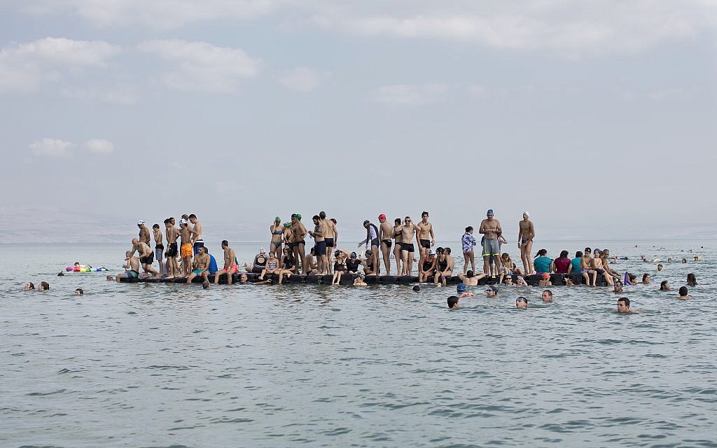 In this Saturday, September 16, 2017, file photo, swimmers participate in the annual Sea of Galilee swim, the oldest and most popular swimming event, near Tiberias, northern Israel. (AP Photo/Oded Balilty)