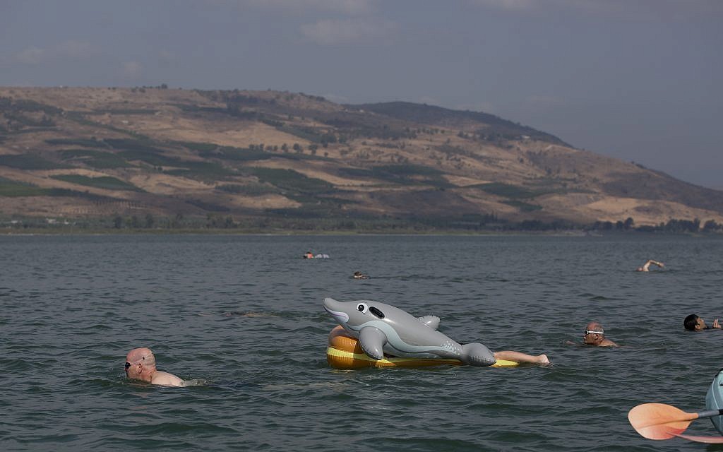 In this Saturday, September 16, 2017, file photo, swimmers participate in the annual Sea of Galilee swim, the oldest and most popular swimming event, near Tiberias, northern Israel. (AP Photo/Oded Balilty)