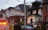 Police and firefighters converge on the scene of a fatal fire in the Sheepshead Bay neighborhood in the Brooklyn borough of New York, Dec. 18, 2017 (AP Photo/Mark Lennihan)