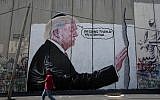 A mural resembling the work of elusive artist Banksy, depicting US President Donald Trump wearing a Jewish skullcap, adorns Israel's West Bank security barrier in Bethlehem, August 4, 2017. (Nasser Nasser/AP)