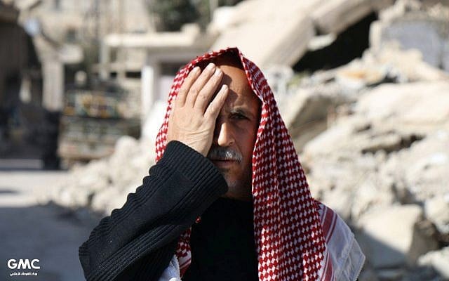 This photo provided on Monday, Dec. 18, 2017 by the Syrian anti-government activist group Ghouta Media Center, which has been authenticated based on its contents and other AP reporting, shows a man in Eastern Ghouta, a rebel-held suburb near the Syrian capital Damascus, covering his right eye in solidarity with Karim, who was injured weeks ago in a government bombing of the market of his hometown. Karim lost his mother and one eye in the bombings and is now becoming the face of a solidarity campaign with Eastern Ghouta, which has been besieged for nearly five years. (Ghouta Media Center via AP) This photo provided on Monday, Dec. 18, 2017 by the Syrian anti-government activist group Ghouta Media Center, which has been authenticated based on its contents and other AP reporting, shows a man in Eastern Ghouta, a rebel-held suburb near the Syrian capital Damascus, covering his right eye in solidarity with Karim, who was injured weeks ago in a government bombing of the market of his hometown. Karim lost his mother and one eye in the bombings and is now becoming the face of a solidarity campaign with Eastern Ghouta, which has been besieged for nearly five years. (Ghouta Media Center via AP)